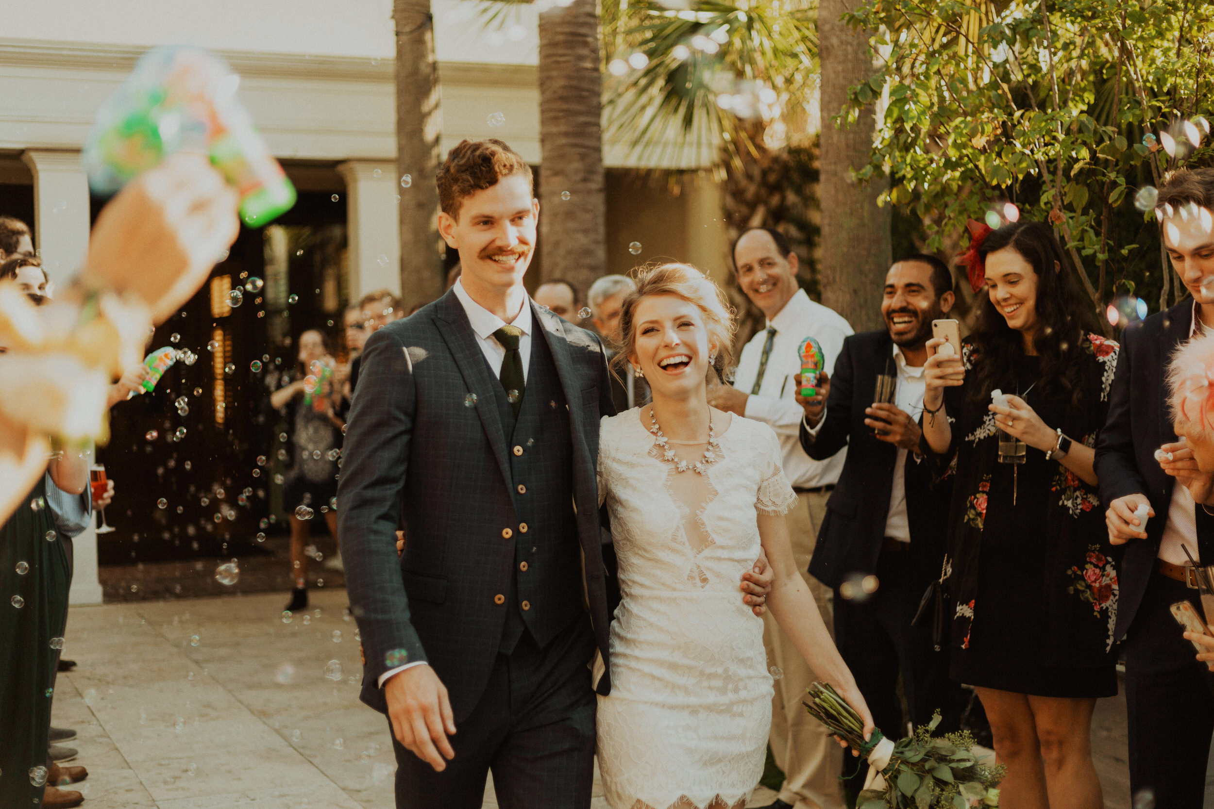 Happy Exit Reception photo, by traveling Wedding + Elopement Photographer Katie Bertagnolli, based in Alabama and traveling worldwide to places like Europe, Hawaii, Alaska, Asia, and the Caribbean to photograph couples who are engaged, getting married, eloping, or just want pictures for themselves.