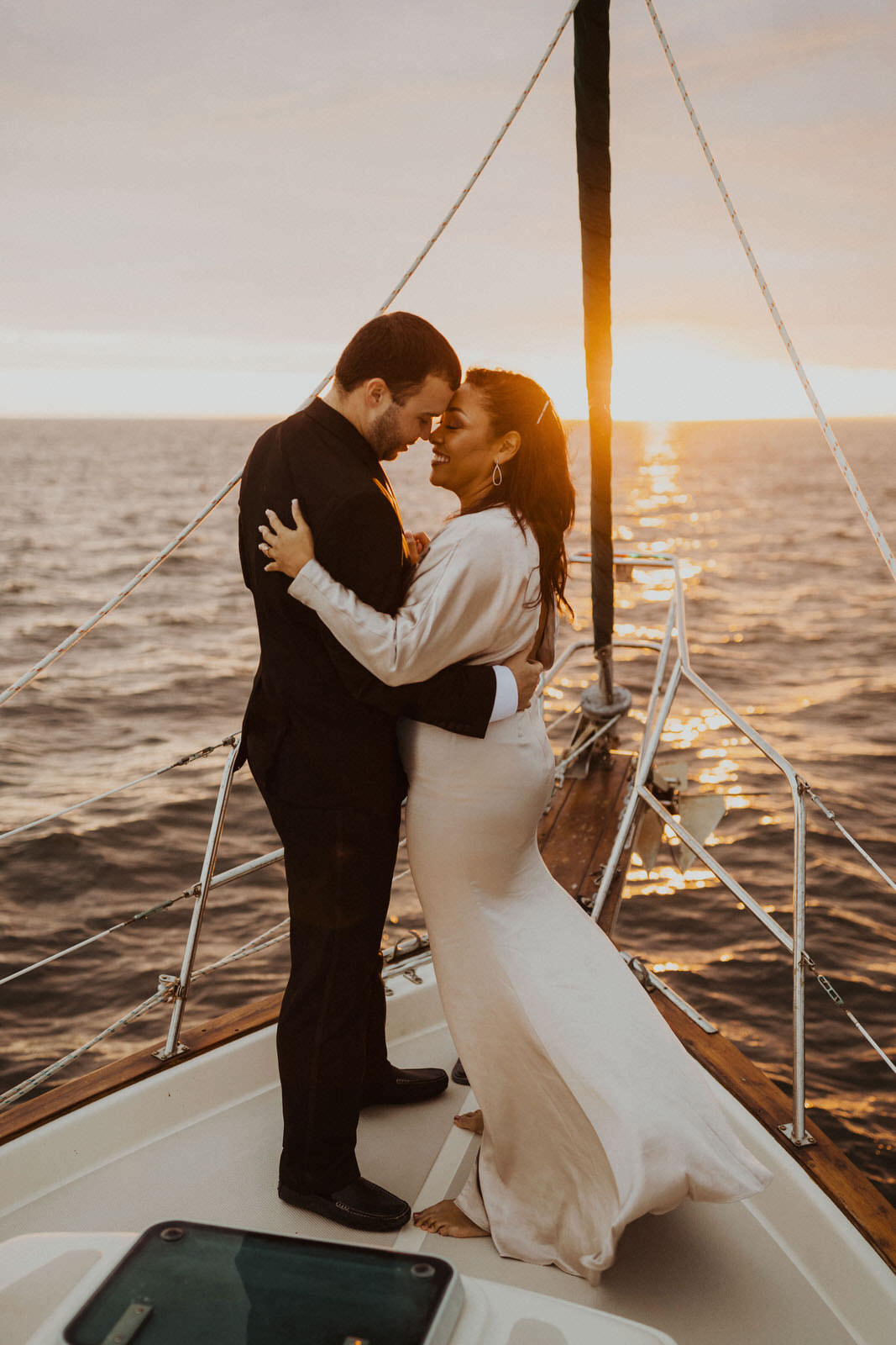 Couple slow dancing on sailboat, engagement photos
